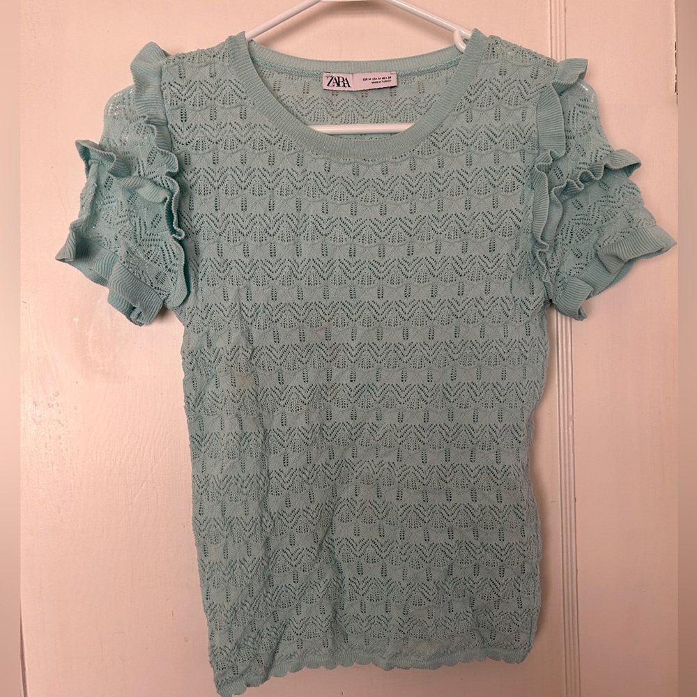 Pointelle knit sweater with ruffle details